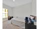 Simple bedroom with a dresser and natural light from the window at 145 Piave St, Haines City, FL 33844