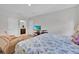 Comfortable bedroom with a large television, and connected bath at 145 Piave St, Haines City, FL 33844