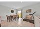 Bright dining room with tile flooring, table set, and access to outdoor space at 145 Piave St, Haines City, FL 33844