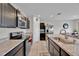 Well-equipped kitchen with stainless steel appliances and tile flooring at 145 Piave St, Haines City, FL 33844