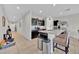 Modern kitchen featuring dark cabinets, stainless steel appliances, and a breakfast bar at 145 Piave St, Haines City, FL 33844