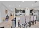 Modern kitchen with stainless steel appliances and large island with seating at 145 Piave St, Haines City, FL 33844