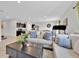 Cozy living room featuring tile floors and an open floorplan with kitchen views at 145 Piave St, Haines City, FL 33844