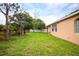 Manicured backyard features lush green grass and mature trees at 1456 Sun Meadow Dr, Orlando, FL 32824