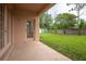 View of the backyard featuring a patio and manicured lawn at 1456 Sun Meadow Dr, Orlando, FL 32824