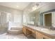 Bright primary bathroom with soaking tub, walk in shower and double vanity at 1456 Sun Meadow Dr, Orlando, FL 32824