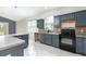 Eat-in kitchen with tiled floors, plentiful cabinet space, and updated stainless steel appliances at 1456 Sun Meadow Dr, Orlando, FL 32824