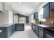 Eat-in kitchen boasting tiled floors, copious cabinet storage, and modern appliances with backyard view at 1456 Sun Meadow Dr, Orlando, FL 32824