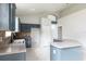 Bright kitchen with tiled floors, ample storage in cabinets, and open layout to the dining area at 1456 Sun Meadow Dr, Orlando, FL 32824