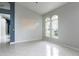 Spacious living area with tile flooring and a view of arched windows for ample natural light at 1456 Sun Meadow Dr, Orlando, FL 32824