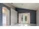 Bright living room features french doors, neutral paint, and tile floors at 1456 Sun Meadow Dr, Orlando, FL 32824