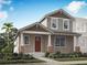 Charming two-story home with manicured landscaping and a welcoming front porch at 152 Royal Ranch Rd, Clermont, FL 34715