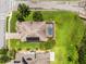 Aerial view of home showcasing the roof, pool, and solar panels in a well-maintained yard at 15900 Citrus Knoll Dr, Winter Garden, FL 34787