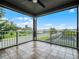 Large balcony featuring tile flooring and views of the surrounding neighborhood and water at 15900 Citrus Knoll Dr, Winter Garden, FL 34787