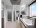 Spacious bathroom with a large soaking tub and views to the main living area at 15900 Citrus Knoll Dr, Winter Garden, FL 34787