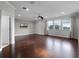Spacious bedroom featuring hardwood floors and three large windows at 15900 Citrus Knoll Dr, Winter Garden, FL 34787