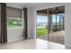 Bedroom featuring sliding doors to the screened in patio, with a lake view at 15900 Citrus Knoll Dr, Winter Garden, FL 34787