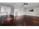 Large bonus room with hardwood floors and a ceiling fan at 15900 Citrus Knoll Dr, Winter Garden, FL 34787