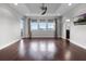 Bonus room with hardwood floors, large windows, and recessed ceiling at 15900 Citrus Knoll Dr, Winter Garden, FL 34787