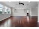 Spacious bonus room featuring hardwood floors and natural lighting at 15900 Citrus Knoll Dr, Winter Garden, FL 34787