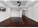 Bonus room featuring hardwood floors and a recessed ceiling at 15900 Citrus Knoll Dr, Winter Garden, FL 34787