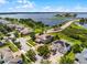 Gorgeous lakefront property with lush landscaping and a brick driveway in a desirable neighborhood at 15900 Citrus Knoll Dr, Winter Garden, FL 34787
