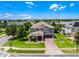 Stunning two story home with a two car garage, brick driveway, and luscious green lawn at 15900 Citrus Knoll Dr, Winter Garden, FL 34787