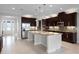 Gourmet kitchen with stainless steel appliances, granite countertops, and a large center island at 15900 Citrus Knoll Dr, Winter Garden, FL 34787