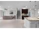 Open concept living room with staircase, and a view of kitchen at 15900 Citrus Knoll Dr, Winter Garden, FL 34787