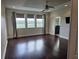 Spacious main bedroom featuring hardwood floors, large windows, and neutral paint, a relaxing retreat at 15900 Citrus Knoll Dr, Winter Garden, FL 34787