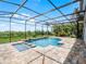 A private pool with fountains, spa, and stepping stones is the perfect backyard paradise at 15900 Citrus Knoll Dr, Winter Garden, FL 34787