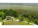 Stunning aerial view of the park with a wooden dock, pavilion, and lush green spaces by the lake at 1593 Osprey View Dr, Apopka, FL 32703