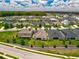 Overhead view of homes in a well-planned neighborhood with lush landscaping and organized street layout at 1593 Osprey View Dr, Apopka, FL 32703