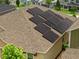 An eye-level view of home's roof, highlighting the modern solar panel setup at 1593 Osprey View Dr, Apopka, FL 32703