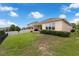 Spacious backyard with well-maintained lawn and partial fencing, offering privacy and space for outdoor activities at 1593 Osprey View Dr, Apopka, FL 32703