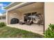 Inviting covered patio features comfortable seating, a hanging swing, and an outdoor grill at 1593 Osprey View Dr, Apopka, FL 32703