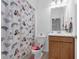 bathroom offering a shower with curtain, vanity with storage and soft lighting at 1593 Osprey View Dr, Apopka, FL 32703