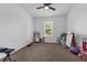 Carpeted bedroom space with a window that provides natural light at 1593 Osprey View Dr, Apopka, FL 32703