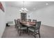 Dining room with seating for ten, a large chandelier, and tile floors at 1593 Osprey View Dr, Apopka, FL 32703