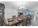 Bright dining room with large table and chairs, perfect for entertaining guests at 1593 Osprey View Dr, Apopka, FL 32703