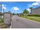 The gated community entrance features stone pillars and manicured landscaping, enhancing curb appeal at 1593 Osprey View Dr, Apopka, FL 32703