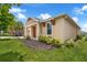 Charming home exterior with manicured landscaping and attractive architectural details, showcasing curb appeal at 1593 Osprey View Dr, Apopka, FL 32703