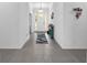 Bright foyer with tiled floor, white walls, front door with sidelights, and an overhead light fixture at 1593 Osprey View Dr, Apopka, FL 32703