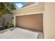 Attached two-car garage with neutral door and clear house-number sign at 1593 Osprey View Dr, Apopka, FL 32703