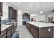 Modern kitchen with an oversized island, stainless steel appliances, and stylish backsplash at 1593 Osprey View Dr, Apopka, FL 32703