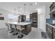Gourmet kitchen features a large island with seating, stainless steel appliances, and lots of natural light at 1593 Osprey View Dr, Apopka, FL 32703