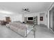Spacious living room featuring tile floors, a ceiling fan, and a large sectional sofa at 1593 Osprey View Dr, Apopka, FL 32703