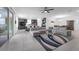 Spacious living room with tile flooring, modern furniture, and sliding glass doors leading to an outdoor area at 1593 Osprey View Dr, Apopka, FL 32703