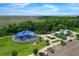 Community playground with a blue awning, adjacent parking, and a covered picnic area at 1593 Osprey View Dr, Apopka, FL 32703