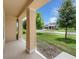 Inviting porch with classic columns, offering a pleasant view of the well-maintained front yard and neighborhood at 1593 Osprey View Dr, Apopka, FL 32703